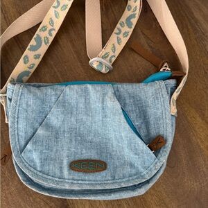 Keen Light Blue Crossbody with Teal Accents and Patterned Tan Strap